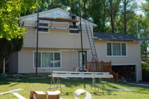 New vinyl siding installation in progress on residential home exterior
