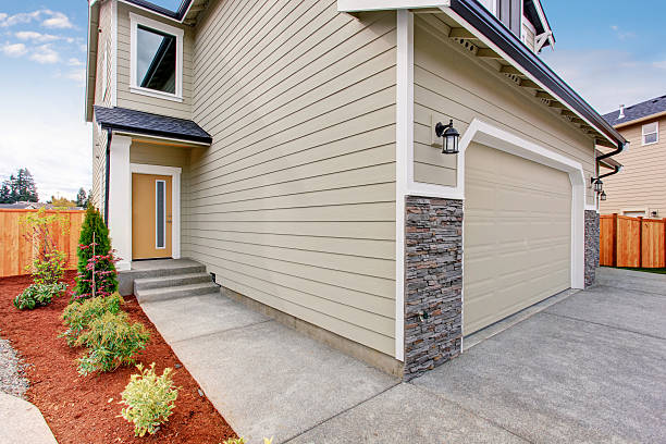 Freshly finished fiber cement siding on two-story residential home
