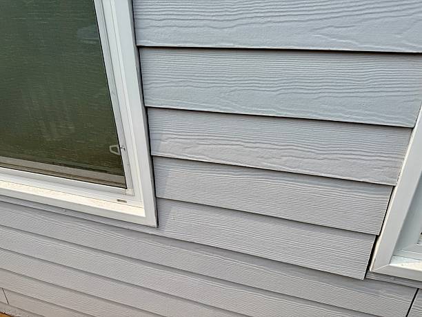 Newly installed engineered wood siding on the home exterior